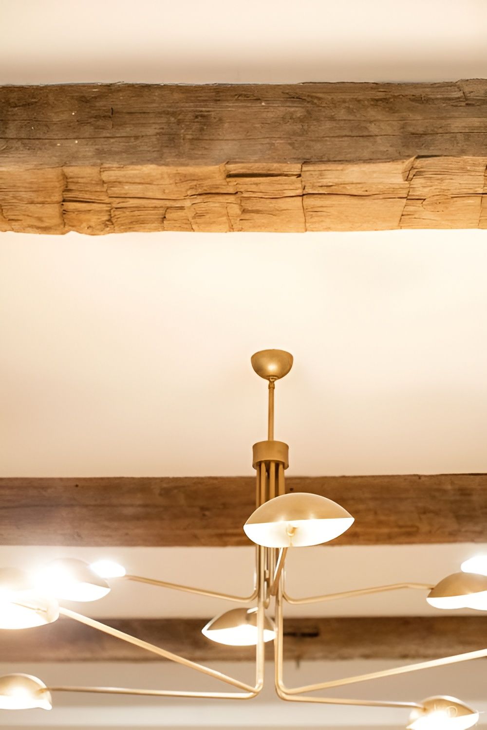 Weathered reclaimed wood paneling detail with nail holes and saw marks
