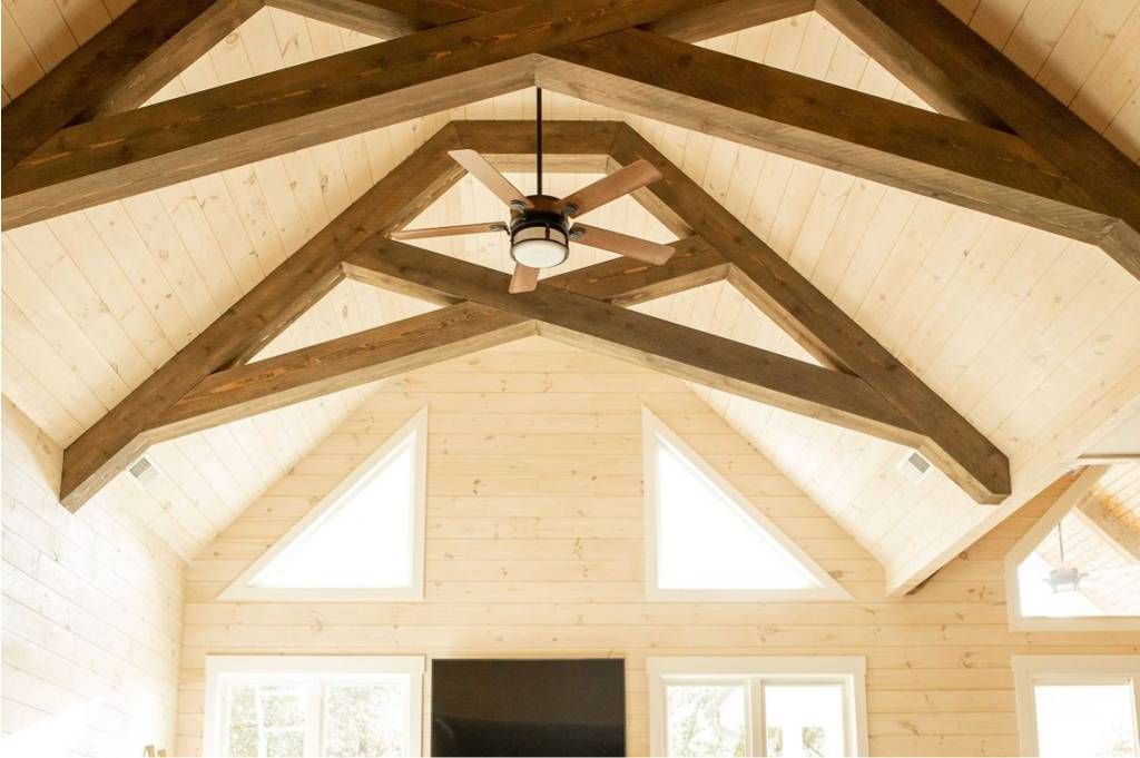 Reclaimed timber beams installed in a finished room