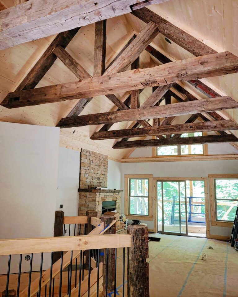 Hand hewn mixed hardwood solid beam trusses in a vaulted ceiling in Maggie Valley, North Carolina